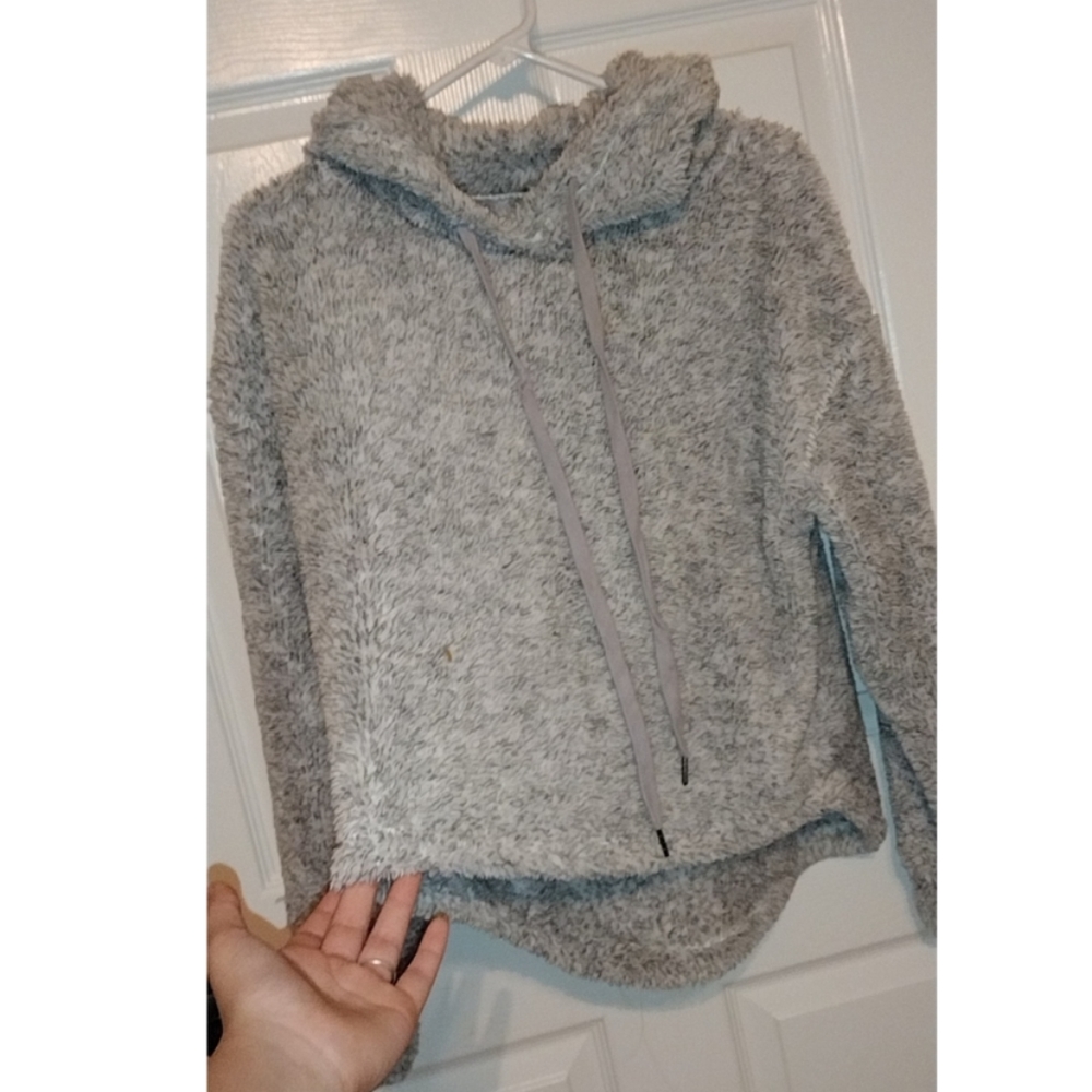 A soft, warm, hoodie, size medium, gray, has an adjustable hood, very comfy